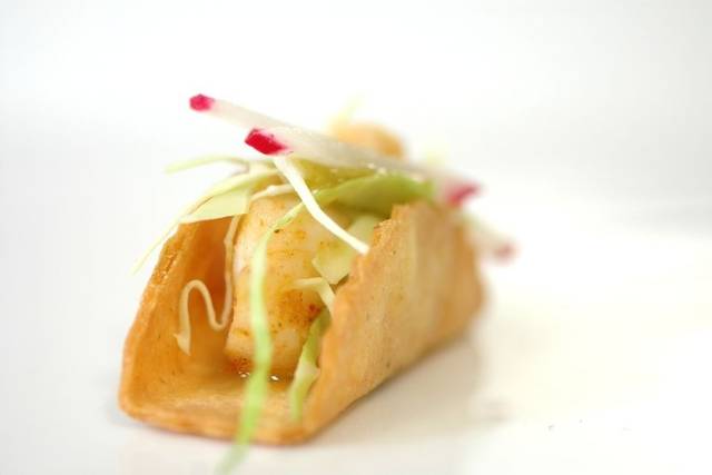 garnished with cabbage slaw, radish ficelles and a home made salsa Verde and an avocado mousse.