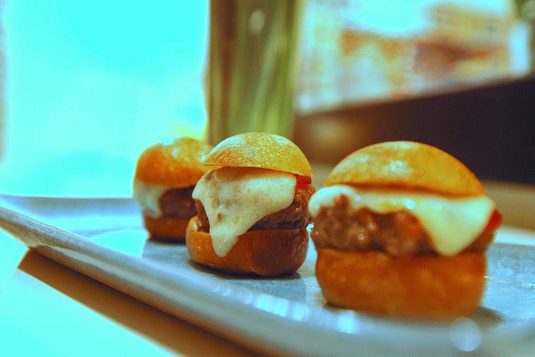 The Mini steak Burger is made with Angus steak in a freshly baked mini Brioche Buns, with Carmelized onions, Fontina cheese, and homemade steak sauce