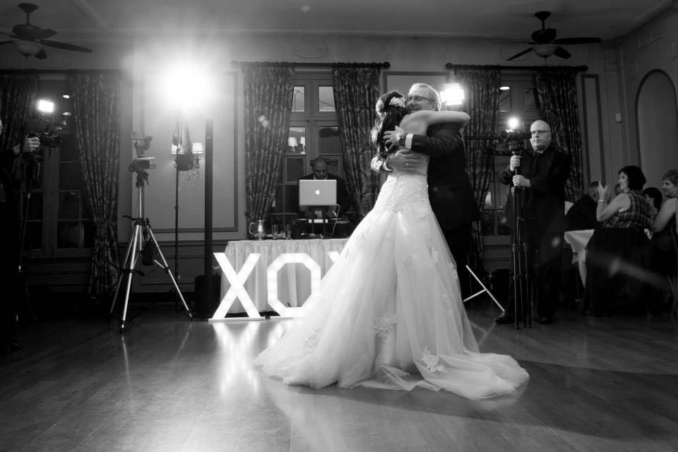 The bride with her father dancing