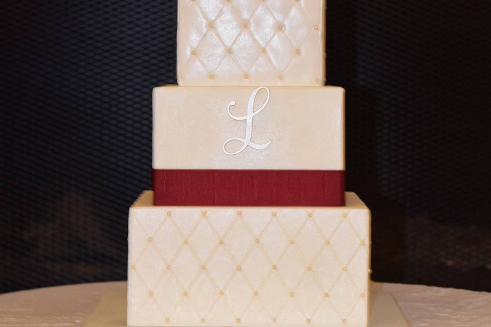 Champagne and maroon wedding cake