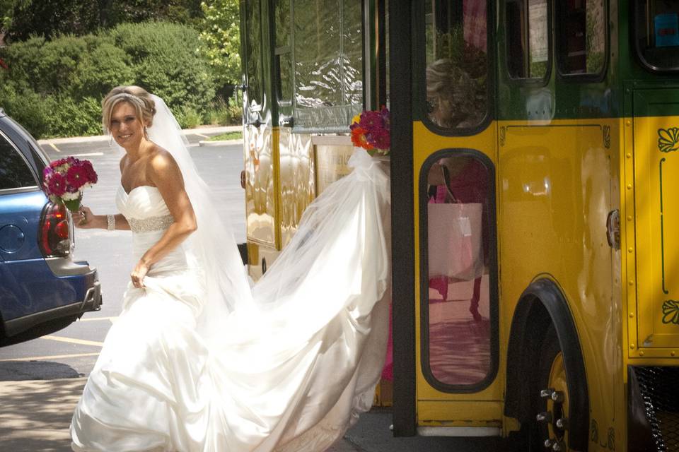 The bride alights from a trolley