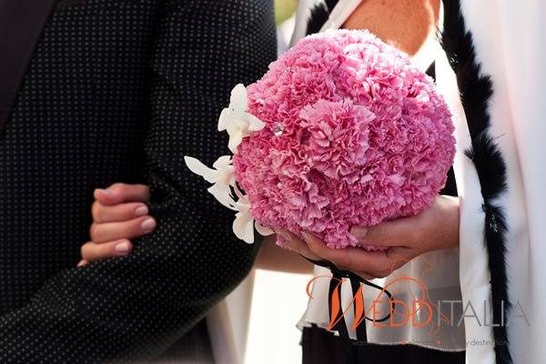 A sphere of hot pink carnations as bridal bouquet - then you are sure to get some attention.