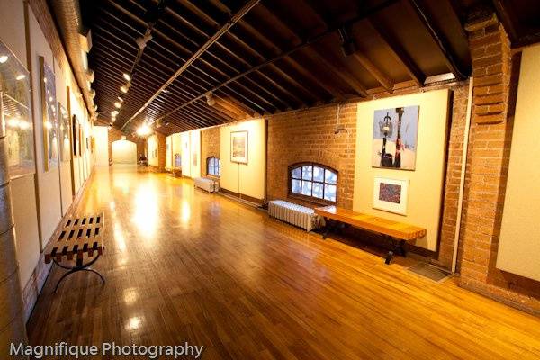 forest green accented metal beam structure with stamped concrete tile flooring enhance the original postal platform of Union Station. Popular for wedding receptions up to 150, banquets up to 180 and meetings up to 200.Taken by Terra Cooper from Magnifique Photography. http://www.magnifiquephotography.comAdd a captionTHEATER ANNEXROOM SIZE: 127'x32'MAX OCCUPANCYtheater 200 | dinner-dance 150 | dinner 180A wide expanse of windows overlook the west rails