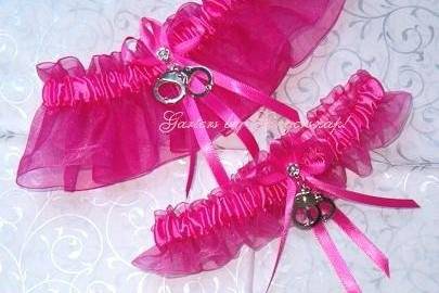 Rhapsody In Pink ~ Created from shocking pink organza material with a shocking pink satin band and moveable handcuffs.
