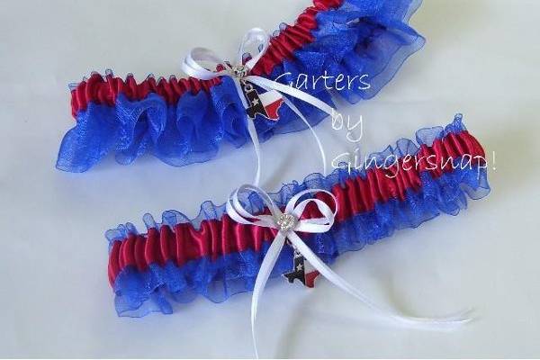Proud to be a Texan!
Show your Texas pride with this fun double ruffle garter made of soft blue
organza. Non-roll elastic is encased in a red satin band. This garter is
embellished with a double white satin bow and features a Texas flag charm in
the shape of the state.
Texas Pride Garter Set