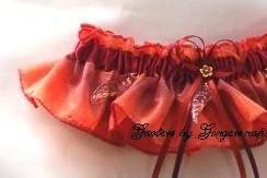 Autumn Splendor Bridal Garter ~ All the colors of autumn with a rich burgundy satin band. Amber colored leaves gently fall from band to complete the Autumn theme.