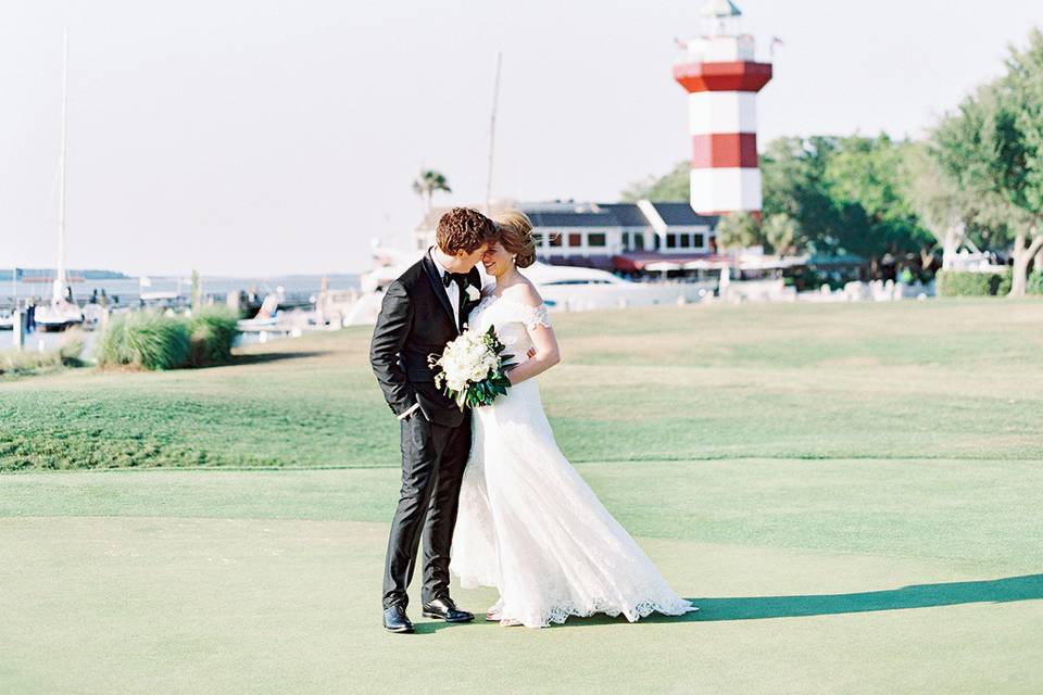 Bride and groom in front of the Harbour Town Lighthouse