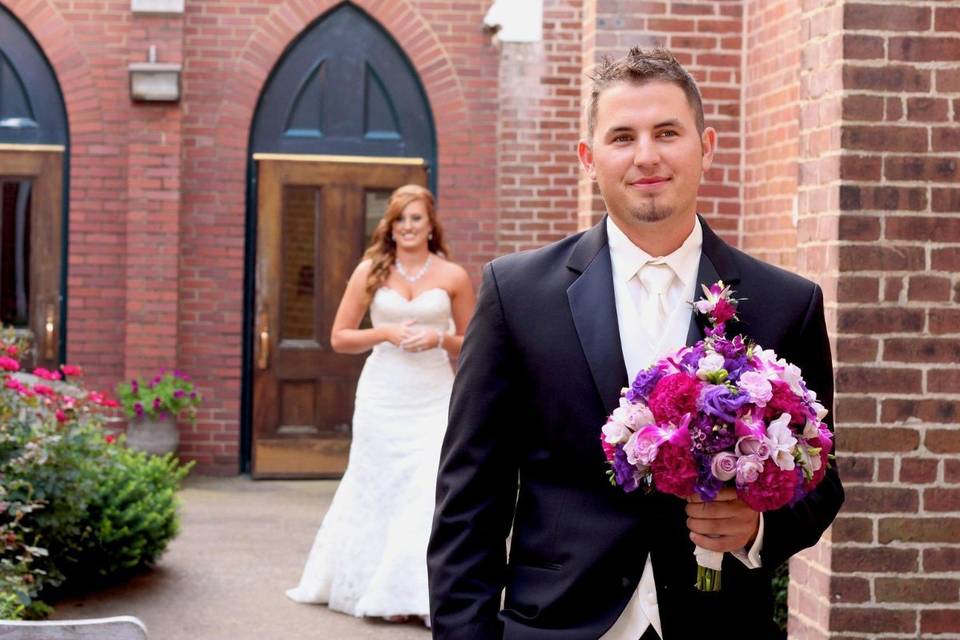 Groom holding wedding bouquet