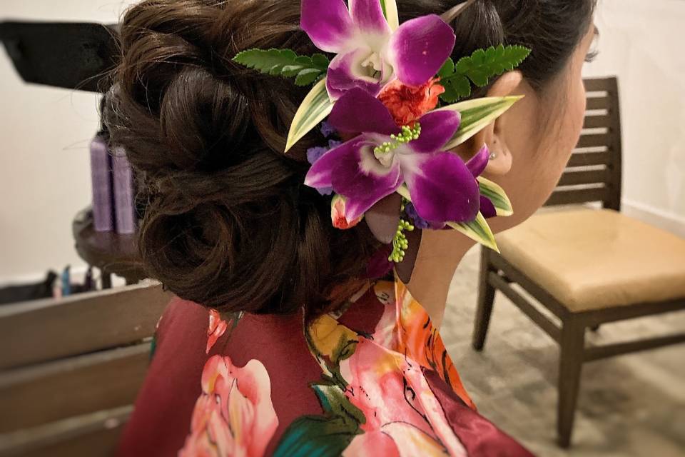 Big low updo with orchids