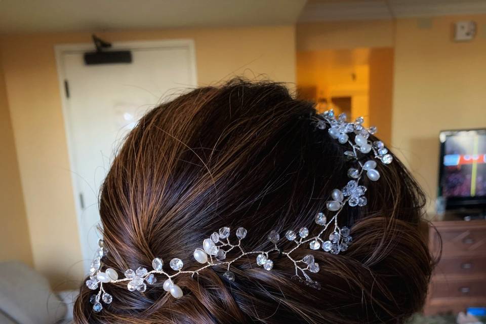 Low updo with crown accessory