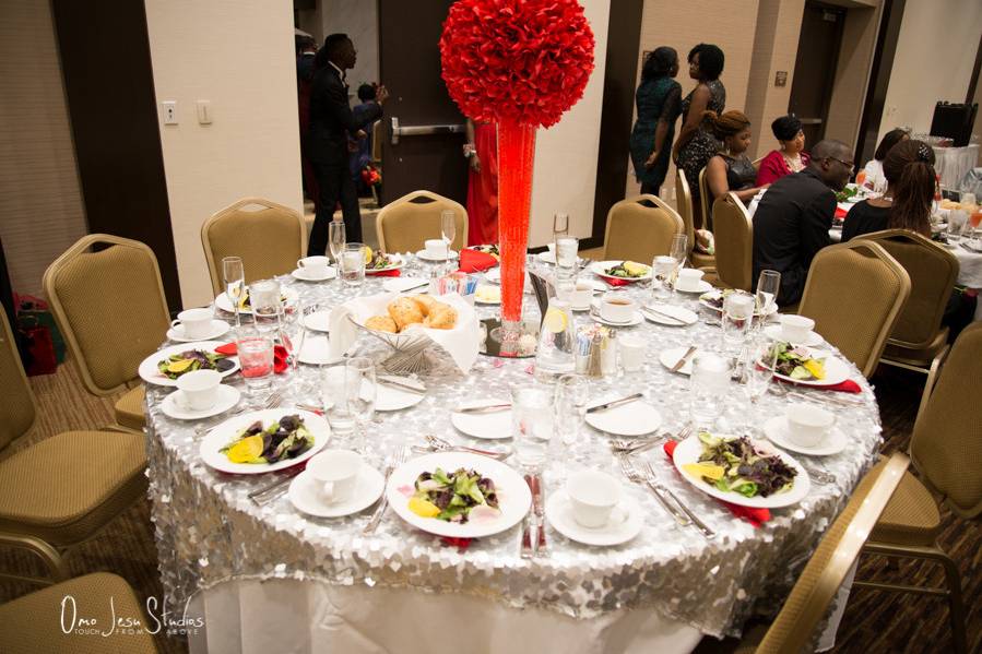 Table setup with red centerpiece