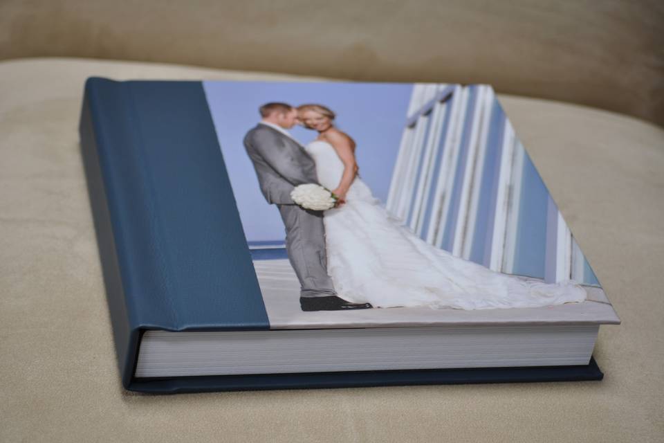 Flush mount wedding album with a photo-panel cover and genuine leather spine and back