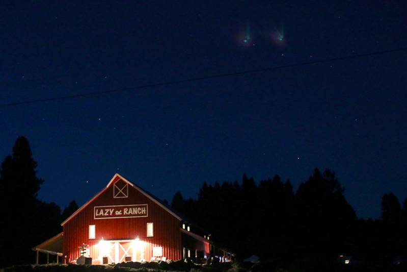 The barn lit up at night