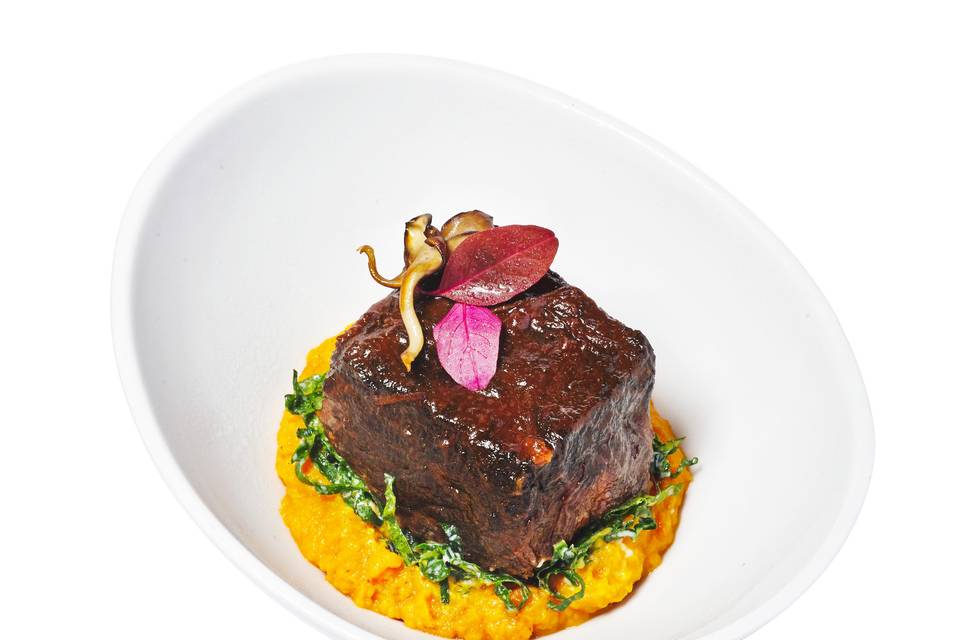 Braised short rib + saffron risotto + shaved black kale