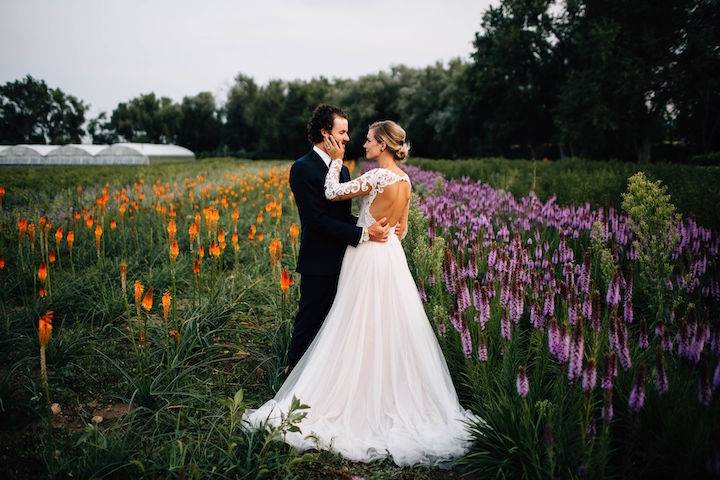 Wedding couple in flower field