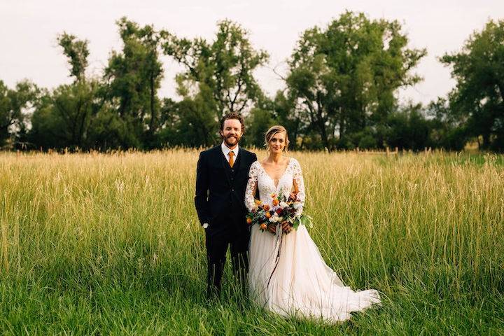 Wedding couple in tall grass