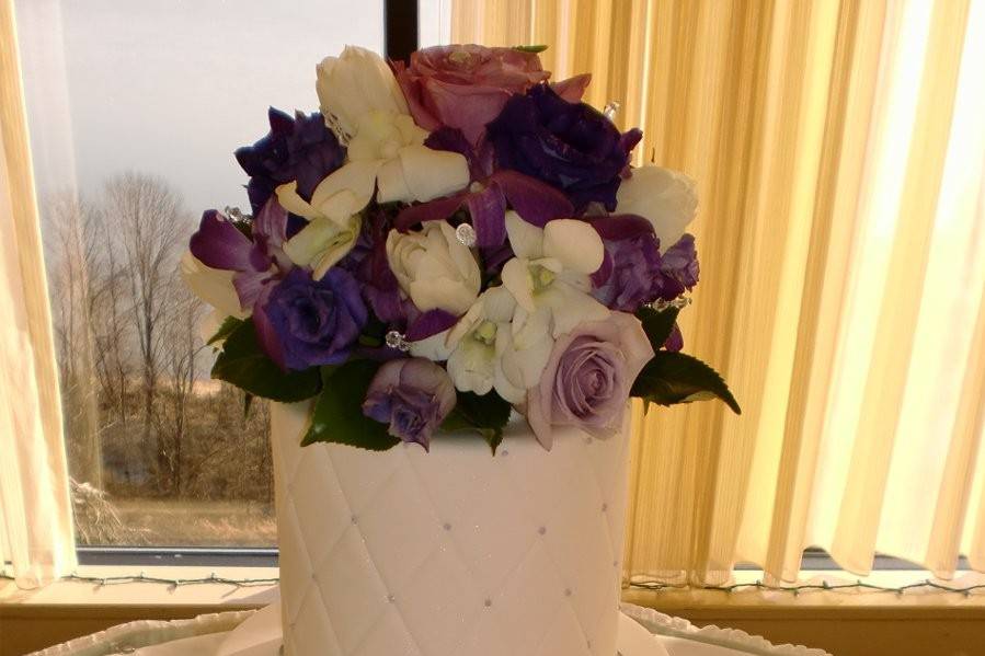 Cake with purple flowers on top