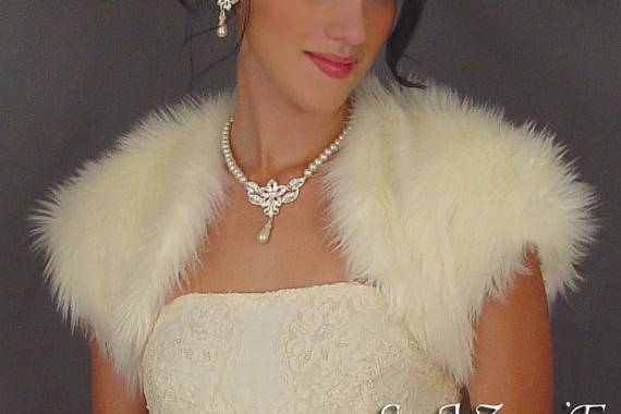 Ivory angora short sleeve faux fur bolero.