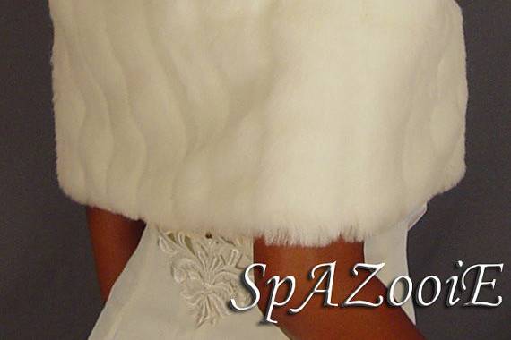 White mink bolero jacket with pelts. Perfect for walking down the isle on your special day. Lined with satin so comfortable.