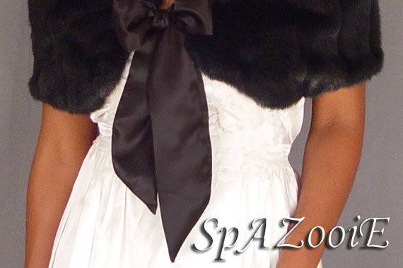 This is our popular black caplet wrap with a bow! Mink pelted faux fur and beautiful!