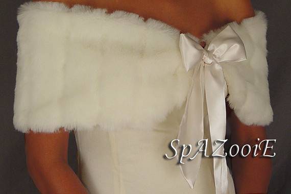 White pelted mink caplet wrap with a bow. Great for when you still want to show your shoulders!