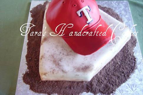 Carved 3D baseball hat and home plate cake.