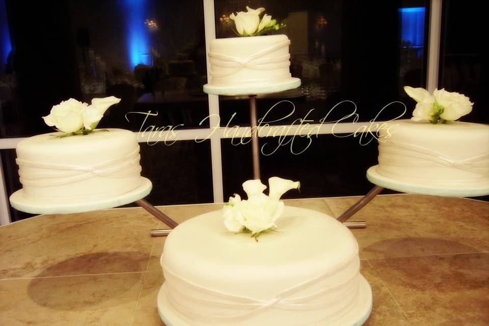 Simple fondant covered cakes with winding fondant ribbons