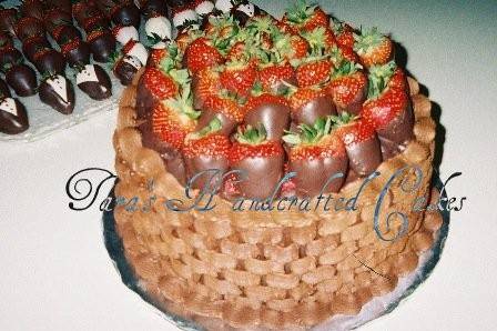 Butter cream frosted grooms cake topped with chocolate covered strawberries. Additional chocolate covered strawberries provided to put around serving tray.