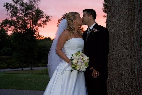 Stealing a kiss at sunset... perfect.