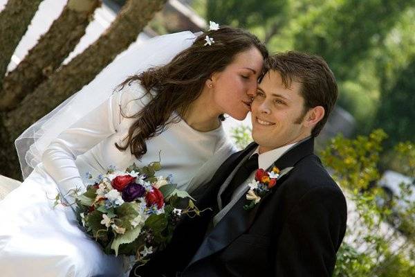 Sneaking a kiss after the ceremony