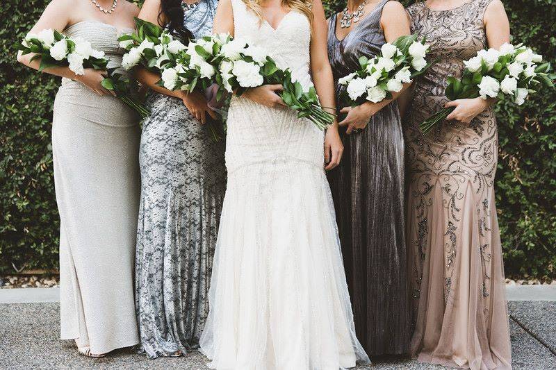 Bride and bridesmaid holding bouquet