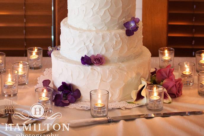 White cake with purple flowera
