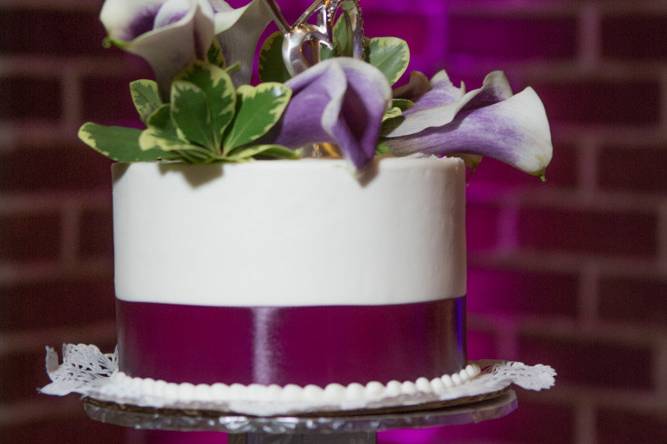 White cake with purple flowera