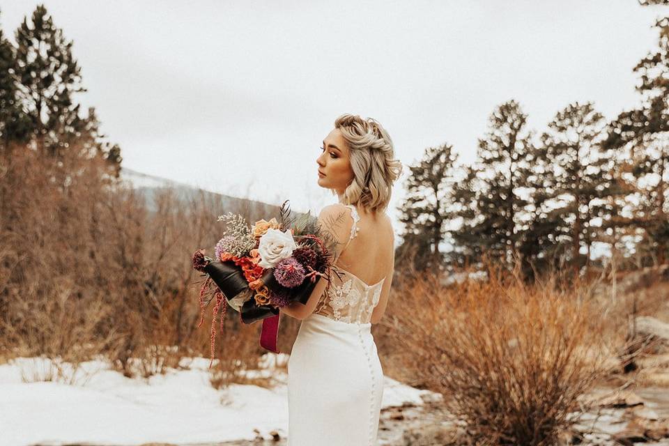 Bride in winter near river