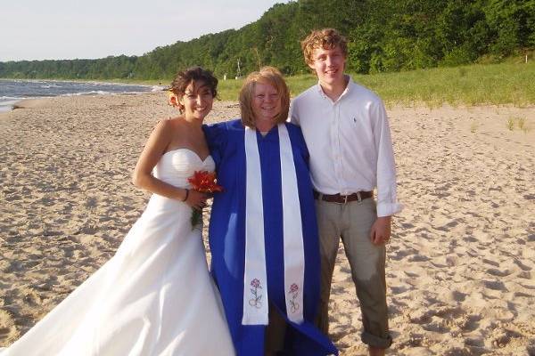 The happy couple and Rev. Carleen