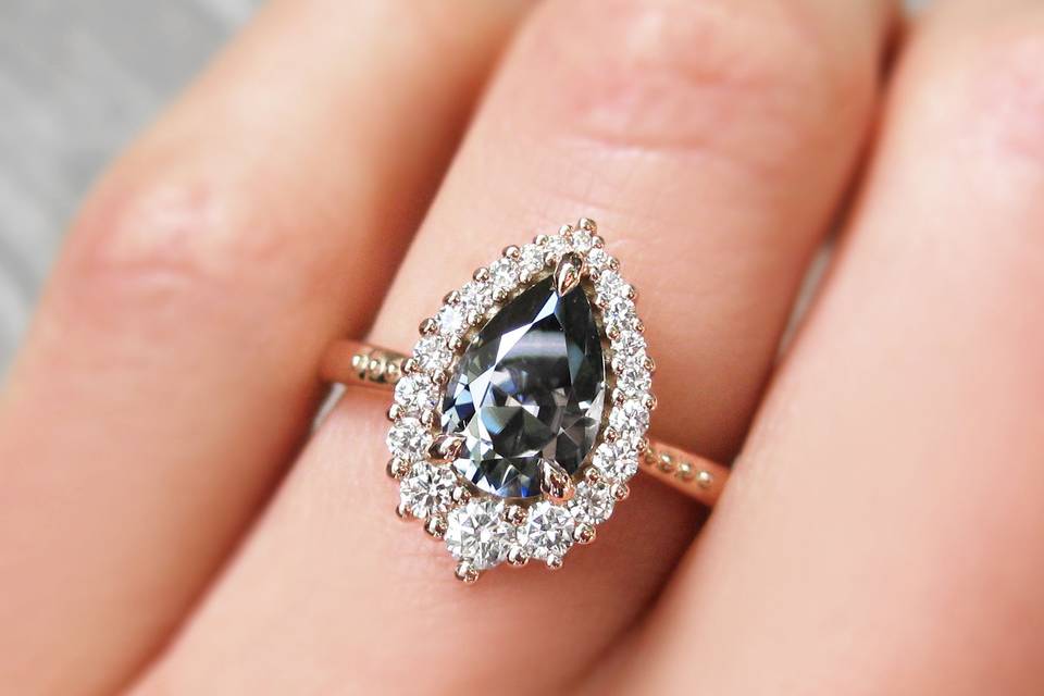 The Celeste, an iconic grey pear mosisanite and canadian diamond halo