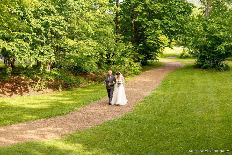 Happy bride and groom share a kiss underneath the stars.