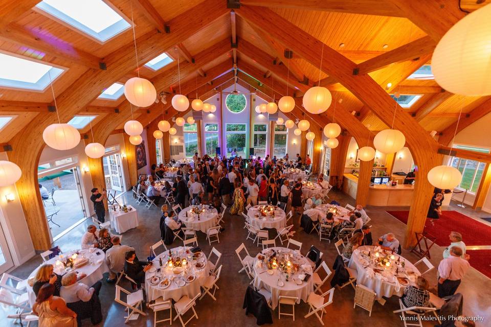 Guests sit down for a delicious gourmet meal as the night begins to blossom!