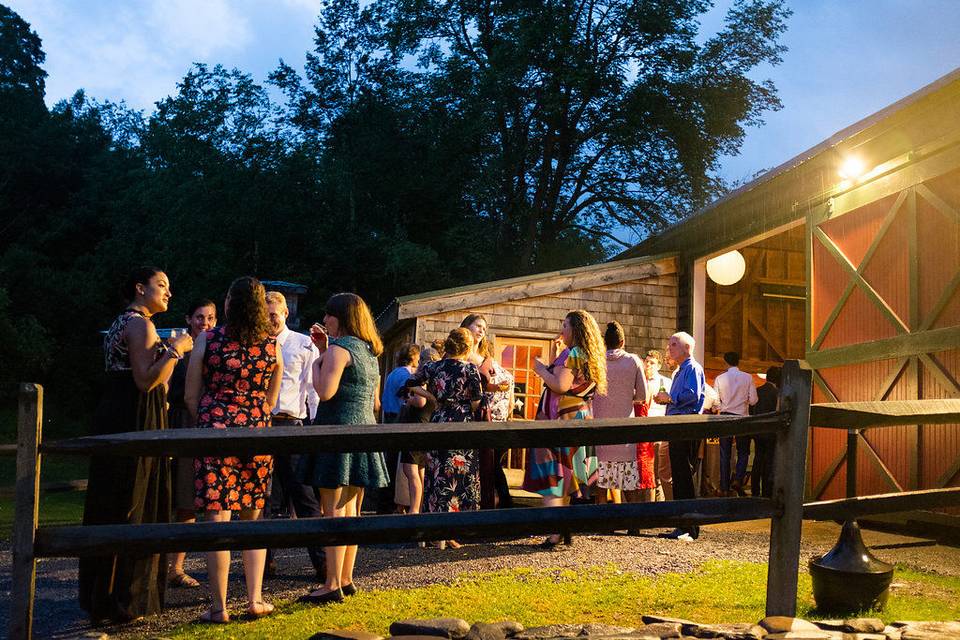 Evening cocktail party begins outside one of our rustic wedding barns