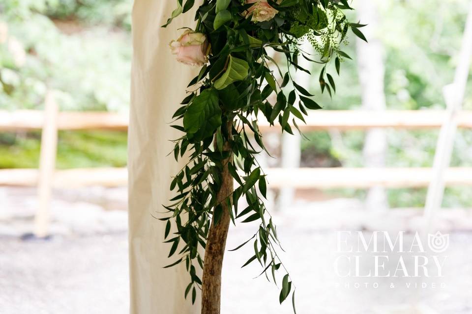 Cheerful bride and groom pause for a moment just outside one of our rustic wedding barns