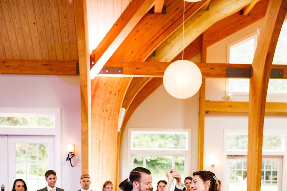 Bridesmaid and groomsman enter the new pavilion to begin the celebration