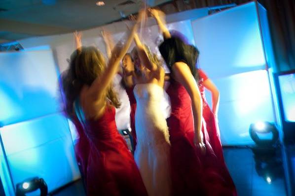 Bride dancing with her bridesmaids