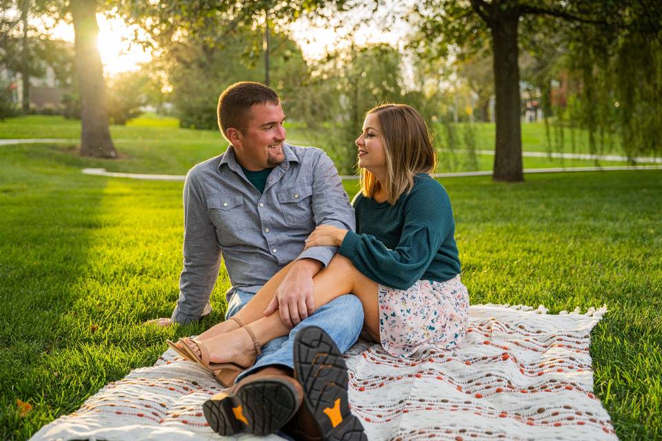 Sunset park couple on blanket