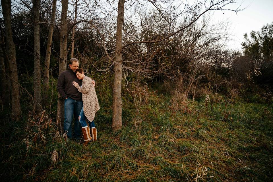 Engaged in the woods sunset