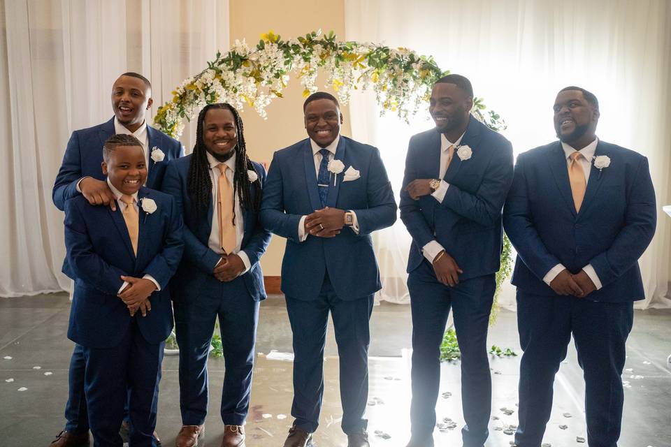 Groomsmen laugh and picture