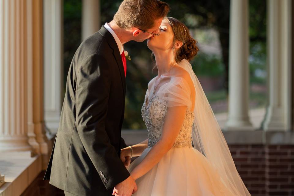 Bride and groom kiss couple