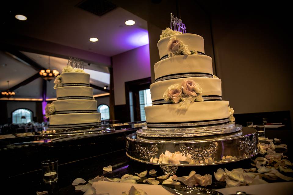 A wedding video still of the couple's cake.