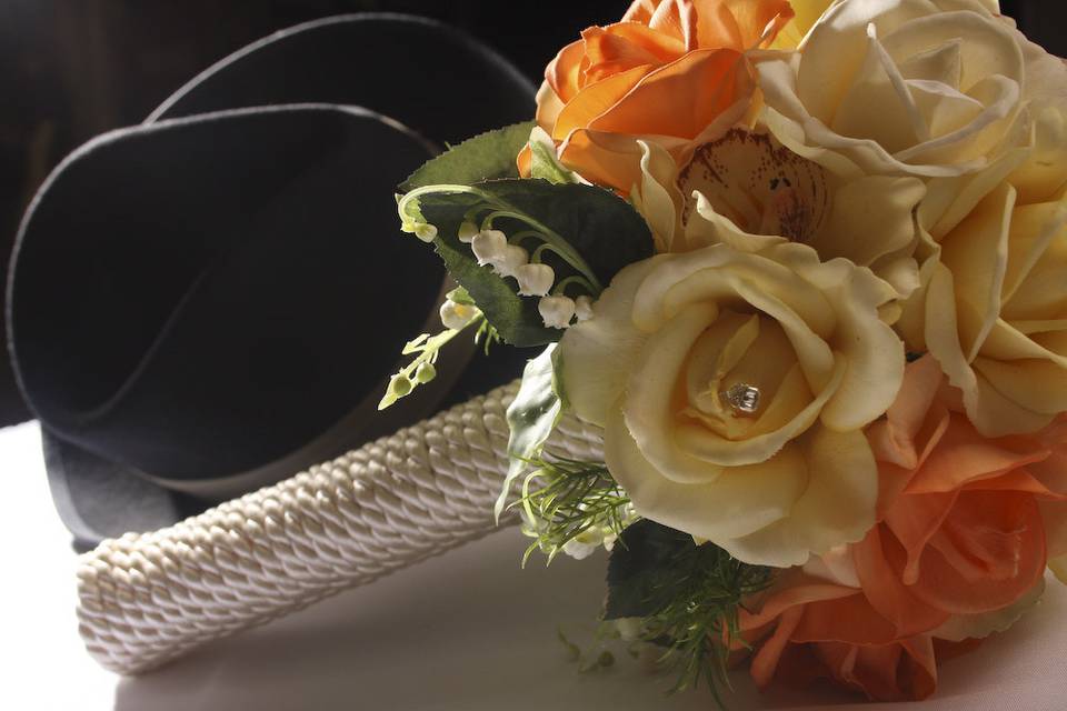 Natural Look Wedding Bouquet Coiled holder. Ivory and Peaching/Orange in color. Roses.