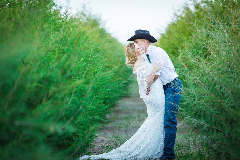 Couple kiss in field