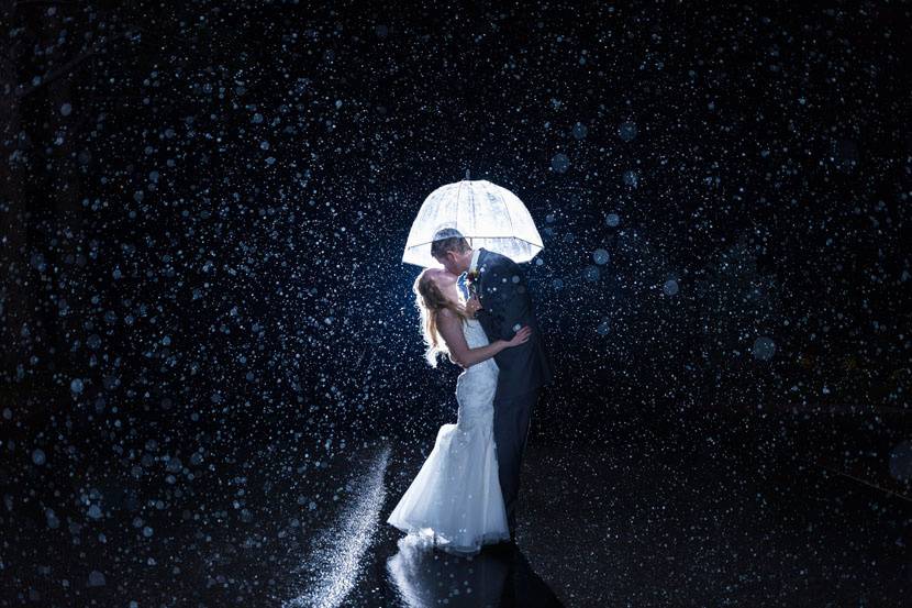 Couple kissing in the rain